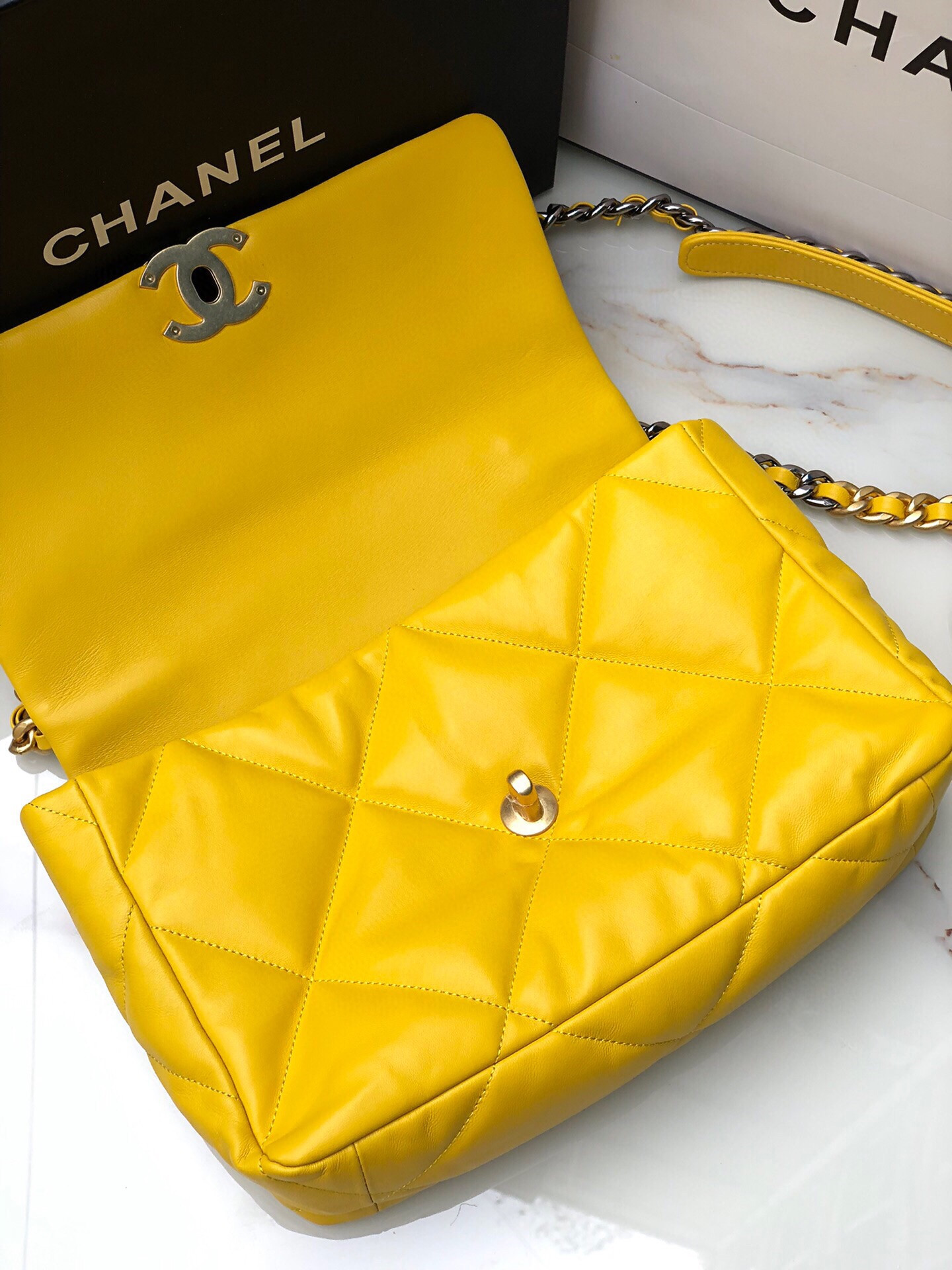 Ch*el 19 large handbag shiny leather, gold-tone, silver-tone & ruthenium-finish metal yellow 7.8 × 11.7 × 3.9 in