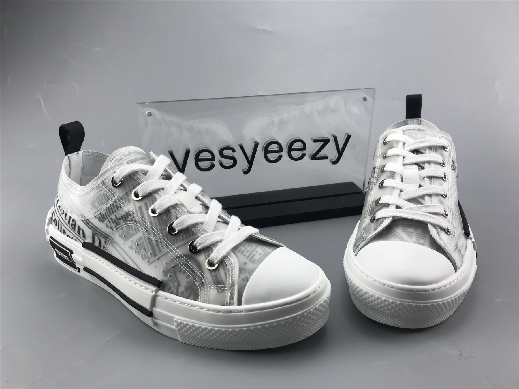 ua D10r b23 low top daniel asham newspaper