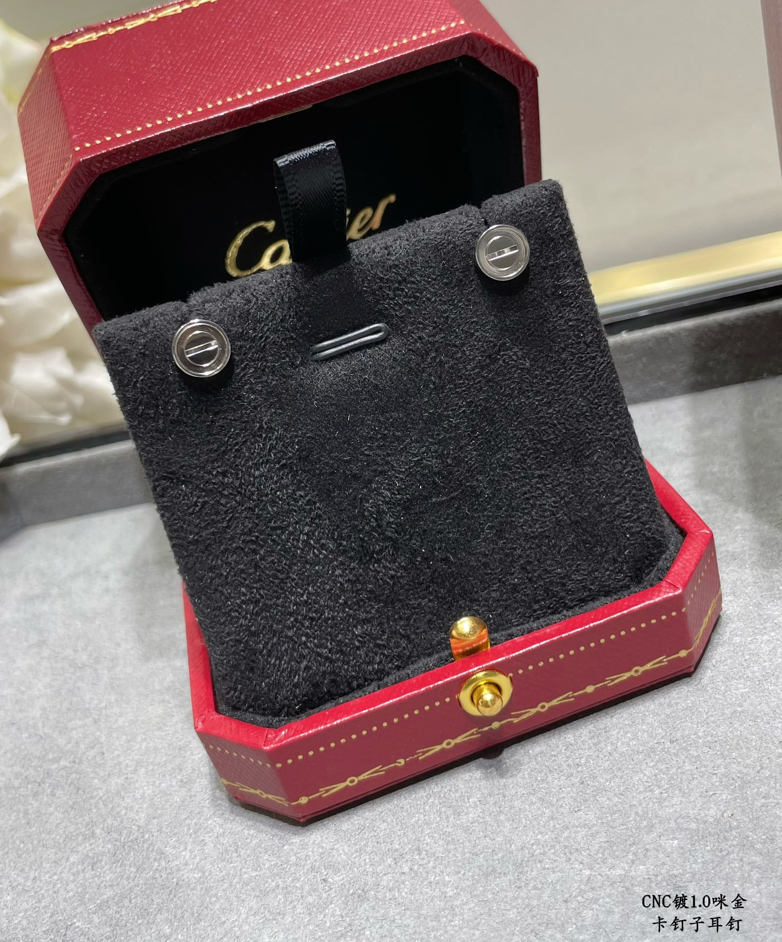 Ca*t1er nail earrings