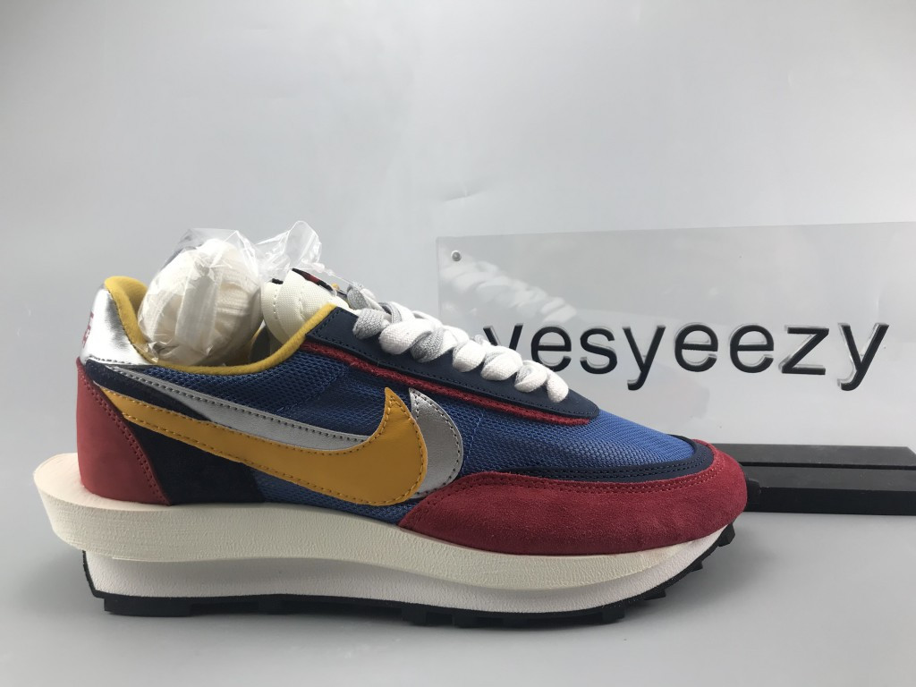 UA NIKE LDWAFFLE/SACAI "VARSITY BLUE"