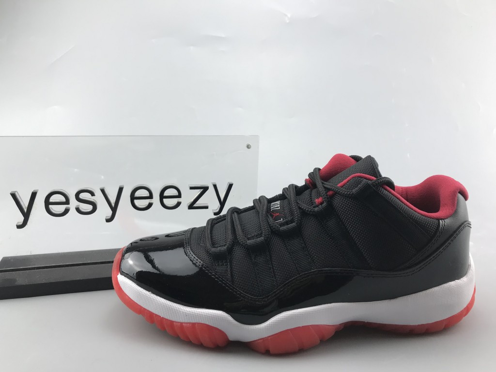 UA AIR JORDAN 11 RETRO LOW BRED