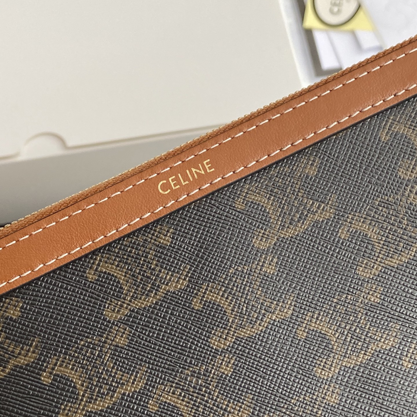 Ce1i*e LONG POUCH WITH STRAP in triomphe canvas and calfskin 21.5x11.5x1cm